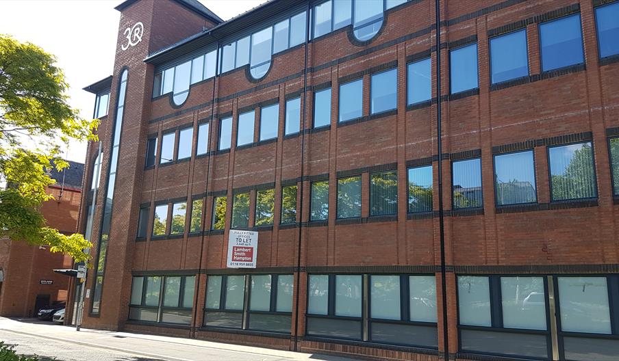 Exterior of glass and brick office building