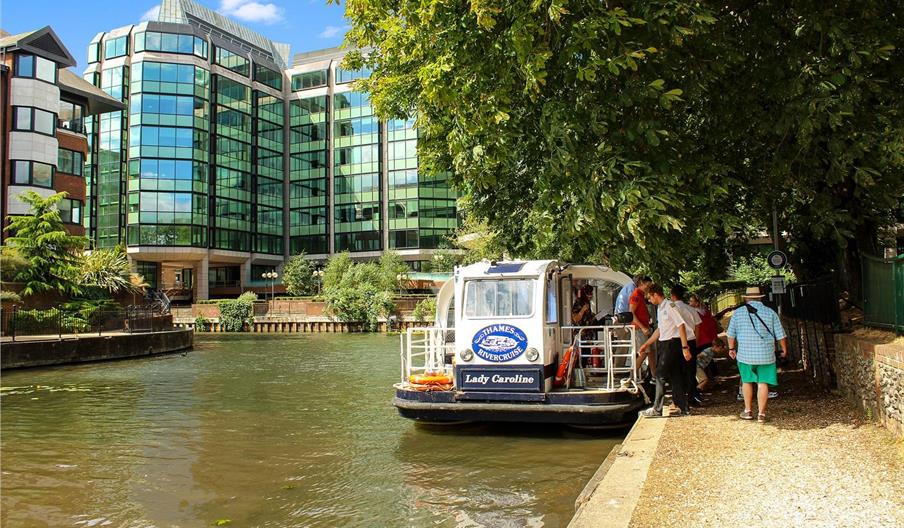 Boat on the River Kennet in front of office block