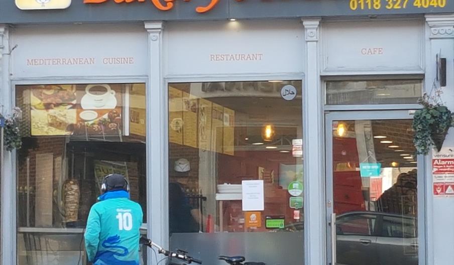 delivery cyclist outside Bakery House