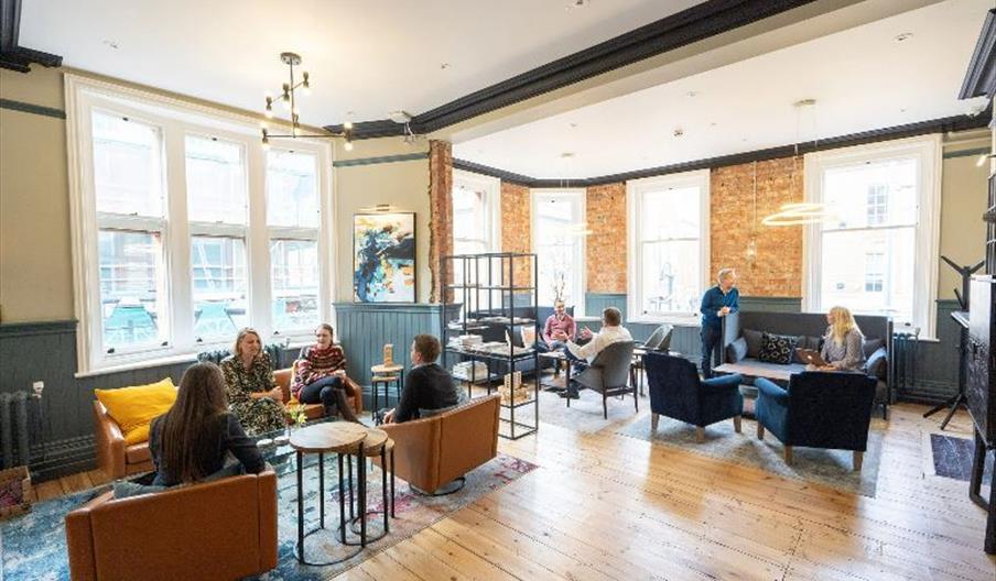 people sitting in informal lounge area