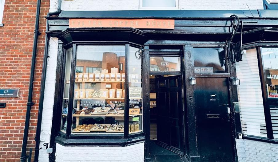 Filter Coffee House exterior, painted black with orange sign