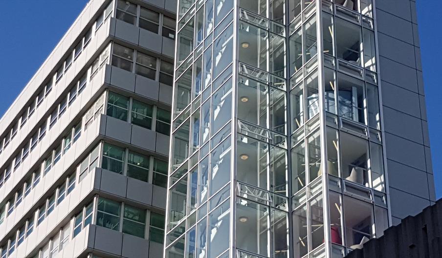 glass and steel office building on skyline