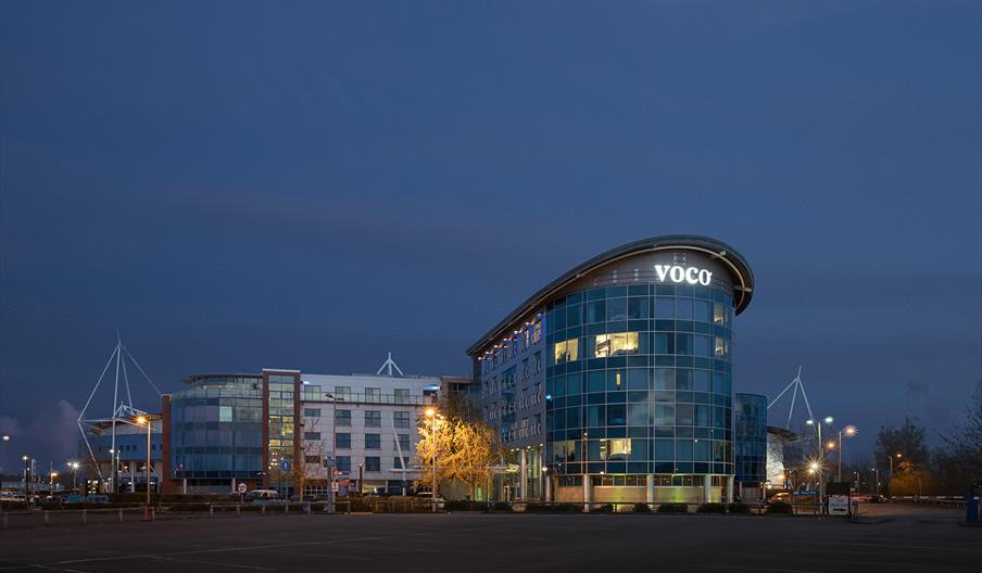 Night time exterior of Voco Reading lit up