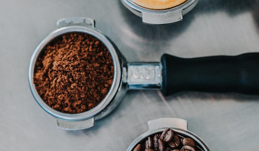 coffee cup, beans and ground coffee