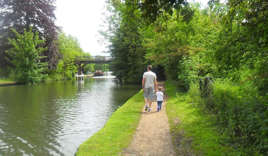 boy and father walking along the Thames Path