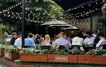 Outdoor seating under string lights