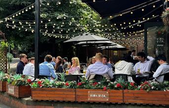 Outdoor seating under string lights