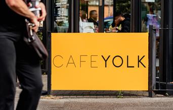 Cafe Yolk yellow sign