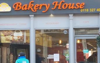 delivery cyclist outside Bakery House