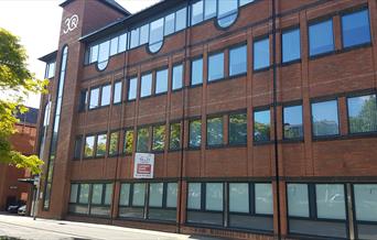 Exterior of glass and brick office building