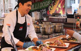 street trader serving Peruvian food