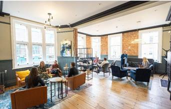 people sitting in informal lounge area