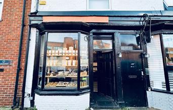 Filter Coffee House exterior, painted black with orange sign