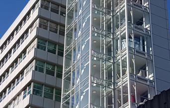 glass and steel office building on skyline