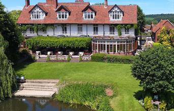 Pond and  lawns in front of hotel