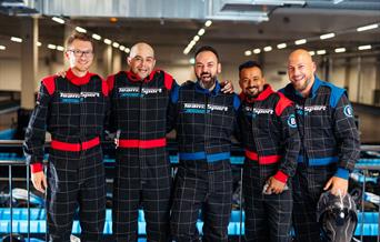 Five men in driving boiler suits