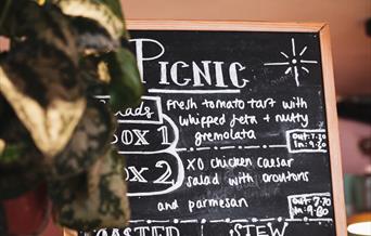 Picnic written on a black board