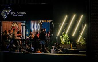 Restaurant front at night with neon lights