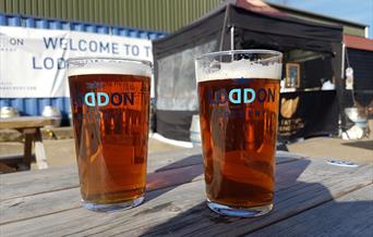 2 pint glasses on a table