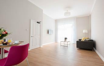 Living room with table, chairs and sofa