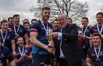 Team receiving a trophy