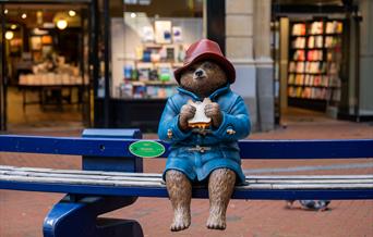 Statue of Paddington Bear holding a marmalade sandwich