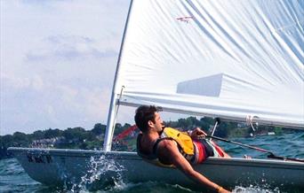 man sailing a dinghy