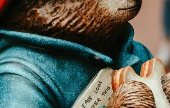Statue of Paddington Bear holding a marmalade sandwich