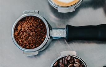 coffee cup, beans and ground coffee