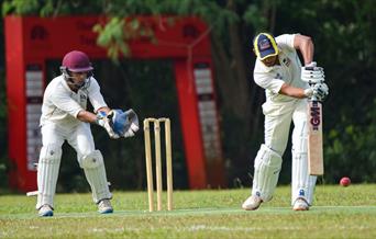 batsman and wicketkeeper in close up