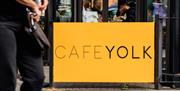 Cafe Yolk yellow sign