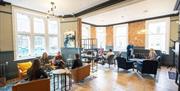people sitting in informal lounge area