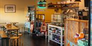 Interior with quirky lights and natural wood furnishings