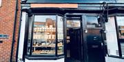 Filter Coffee House exterior, painted black with orange sign
