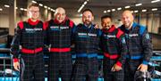 Five men in driving boiler suits