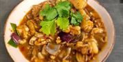 Chinese dish with coriander garnish