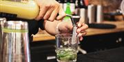 pouring a cocktail