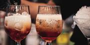 Pouring an aperol spritz