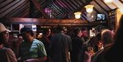 low lighting, people chatting