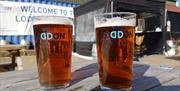 2 pint glasses on a table