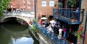 dining outside next to the canal