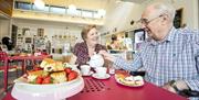 Visitors enjoying a cream tea in the MERL cafe