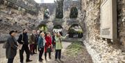 Guided tour in the Chapter House of the Abbey Ruins