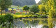 Children by scenic river