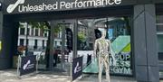 Front of building with metal mannequin outside