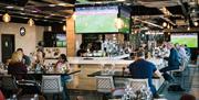 Bar with football playing on TVs