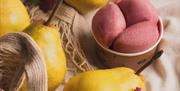 scoops of sorbet beside pears