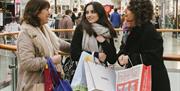 3 women Christmas shopping inside the Oracle shopping centre