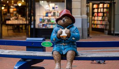 Statue of Paddington Bear holding a marmalade sandwich