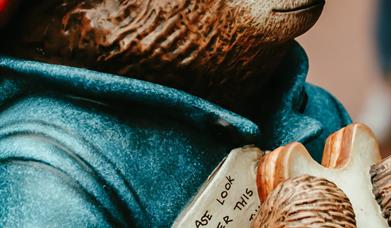 Statue of Paddington Bear holding a marmalade sandwich